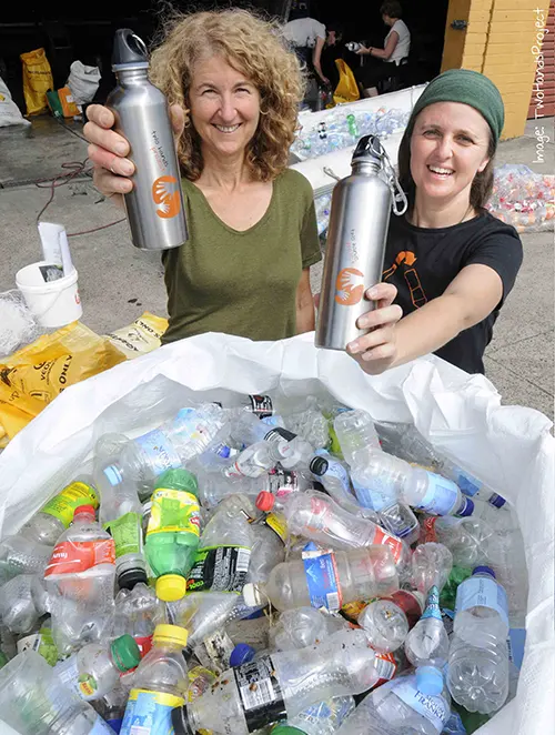 https://www.factorydirectpromos.com/wp-content/uploads/2014/06/women-holding-aluminum-water-bottles.webp